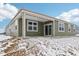 Exterior view of the home with a covered patio and a green siding at 7840 Magnolia St, New Palestine, IN 46163