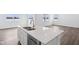 This bright kitchen has an island with a double sink and a stainless steel dishwasher at 7840 Magnolia St, New Palestine, IN 46163