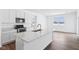 Open kitchen featuring stainless steel appliances, a center island and natural lighting at 7840 Magnolia St, New Palestine, IN 46163
