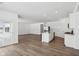 Open concept living area seamlessly connects to the kitchen and has access to the patio at 7840 Magnolia St, New Palestine, IN 46163