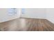 Spacious living room featuring hardwood floors, natural light, and a modern, open layout at 7840 Magnolia St, New Palestine, IN 46163