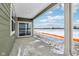 View of the covered patio featuring a sliding glass door, and a concrete surface at 7840 Magnolia St, New Palestine, IN 46163