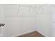 Walk-in closet with carpet floor and wire shelving for organized storage at 7840 Magnolia St, New Palestine, IN 46163