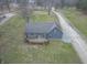 Aerial view of the property showcasing its wooden deck and exterior details at 11197 N Gasburg Rd, Mooresville, IN 46158