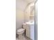 Cozy bathroom features a white vanity with a sink and a toilet at 11197 N Gasburg Rd, Mooresville, IN 46158
