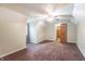 This is a bedroom with an attached walk-in closet, brown carpet and cream colored walls at 11197 N Gasburg Rd, Mooresville, IN 46158