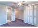 Carpeted bedroom showcasing closet and access to bathroom at 11197 N Gasburg Rd, Mooresville, IN 46158