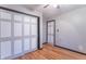 Bedroom featuring hardwood floors, closet and painted doors and trim at 11197 N Gasburg Rd, Mooresville, IN 46158