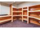 Spacious bonus room with custom built-in shelving, perfect for storage or hobbies at 11197 N Gasburg Rd, Mooresville, IN 46158