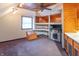 Cozy bonus room with built-in shelving, fireplace, and a convenient sink area at 11197 N Gasburg Rd, Mooresville, IN 46158
