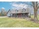 Charming two-story gray home with a covered front porch and well-maintained lawn at 11197 N Gasburg Rd, Mooresville, IN 46158