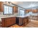 Bright kitchen featuring a large island with seating, counter space, and windows at 11197 N Gasburg Rd, Mooresville, IN 46158