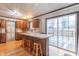 Updated kitchen features an island with bar seating and a sliding door to the deck at 11197 N Gasburg Rd, Mooresville, IN 46158