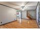 Spacious living room with hardwood floors and a ceiling fan; stairs to the right are visible at 11197 N Gasburg Rd, Mooresville, IN 46158