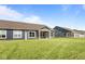Lush backyard featuring a covered patio that connects with other homes in the neighborhood at 16892 Cattle Hollow Ln, Noblesville, IN 46060
