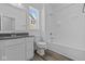 A full bathroom features a shower-tub combo, single sink vanity and wood-look flooring at 16892 Cattle Hollow Ln, Noblesville, IN 46060