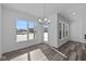 Bright dining area features large windows, stylish lighting and backyard access at 16892 Cattle Hollow Ln, Noblesville, IN 46060