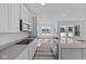Modern kitchen featuring stainless appliances, and gray countertops at 16892 Cattle Hollow Ln, Noblesville, IN 46060