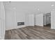Spacious living room with fireplace and vinyl plank flooring at 16892 Cattle Hollow Ln, Noblesville, IN 46060