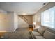 Simple living room with beige couch and entryway at 23 Trails End St, Greenwood, IN 46142