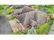 An aerial view of a brick home featuring a gray roof, landscaping, and attached two-car garage at 316 Northpointe Ct, Danville, IN 46122