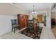 Cozy dining room featuring wainscoting, stylish decor, and a decorative chandelier at 316 Northpointe Ct, Danville, IN 46122