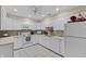 Bright kitchen with tile backsplash, modern appliances, and white cabinetry at 316 Northpointe Ct, Danville, IN 46122