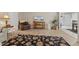 Living room with a leather recliner, side table, and access to the dining room at 316 Northpointe Ct, Danville, IN 46122