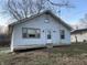 Simple white house with a wooden deck and yard at 412 S Main St, Brooklyn, IN 46151