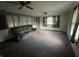 Living room with gray couch and ceiling fan at 412 S Main St, Brooklyn, IN 46151