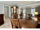 Formal dining room featuring a wood table and display cabinet at 4140 Melbourne Rd, Indianapolis, IN 46228