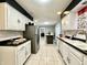 Kitchen boasts ample counter space and white cabinetry at 4140 Melbourne Rd, Indianapolis, IN 46228