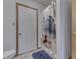 Bathroom with white walls features a shower, a toilet and a door at 4208 E Epler Ave, Indianapolis, IN 46237