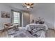 Cozy bedroom featuring a decorative headboard, ceiling fan, and stylish decor at 4208 E Epler Ave, Indianapolis, IN 46237