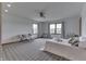 This bedroom features a ceiling fan, natural light, and neutral walls at 4208 E Epler Ave, Indianapolis, IN 46237