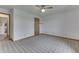 Spacious bedroom features a ceiling fan, neutral walls and patterned carpet, and closet at 4208 E Epler Ave, Indianapolis, IN 46237