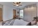 Comfortable bedroom with a ceiling fan, wardrobe, and a view to the outside at 4208 E Epler Ave, Indianapolis, IN 46237