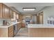Bright kitchen features wood cabinets, stainless steel appliances, and an island with a marble countertop at 4208 E Epler Ave, Indianapolis, IN 46237