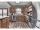 Traditional-style kitchen featuring wood cabinets, stainless appliances and a neutral color scheme at 4208 E Epler Ave, Indianapolis, IN 46237