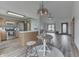 Open floor plan with eat-in kitchen, stainless steel appliances, and hardwood flooring at 4208 E Epler Ave, Indianapolis, IN 46237
