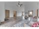 Expansive living area with an open layout, hardwood floors, and a view into the kitchen at 4208 E Epler Ave, Indianapolis, IN 46237