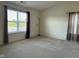 Bright bedroom with large windows, neutral carpeting, and decorative window treatments at 672 Rocky Meadow Dr, Greenwood, IN 46143