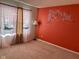 Bedroom featuring an accent wall with bird and floral decal, soft carpet, and decorative curtains at 672 Rocky Meadow Dr, Greenwood, IN 46143