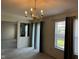 Bright Dining Room featuring a chandelier and natural light from the double window at 672 Rocky Meadow Dr, Greenwood, IN 46143