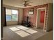 Cozy living room featuring a ceiling fan, decorative brick, and a view into another room at 672 Rocky Meadow Dr, Greenwood, IN 46143