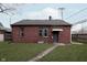 Brick building in the backyard with a grassy area at 726 E 54Th St, Indianapolis, IN 46220