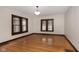 Hardwood floors and large windows in this living room at 726 E 54Th St, Indianapolis, IN 46220