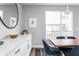 Elegant dining area features a live edge wood table and white cabinetry at 9895 Baneberry Ln, Carmel, IN 46290