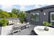 Modern rooftop deck features comfortable seating and a dining area, perfect for outdoor entertaining at 9895 Baneberry Ln, Carmel, IN 46290