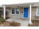 Covered porch with white columns and blue front door at 2010 14Th St, Columbus, IN 47201